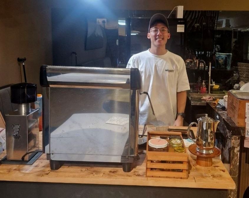 Barista at Element Coffee cart with commercial espresso setup